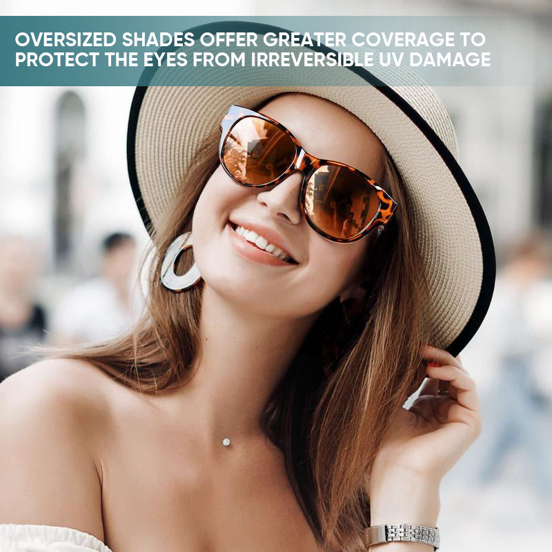Overzet zonnebril met cat-eye montuur en getinte glazen