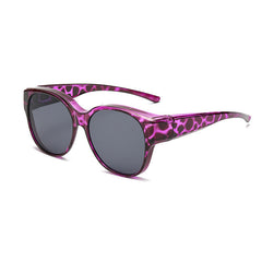Overzet zonnebril met cat-eye montuur en getinte glazen