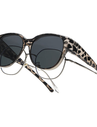 Overzet zonnebril met cat-eye montuur en getinte glazen