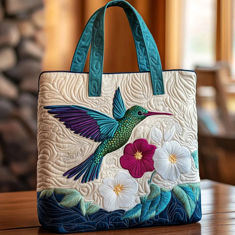 Gewatteerde shopper tas met print van een kolibrie en een witte bloem