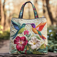 Gewatteerde shopper tas met print van een kolibrie tussen witte bloemen