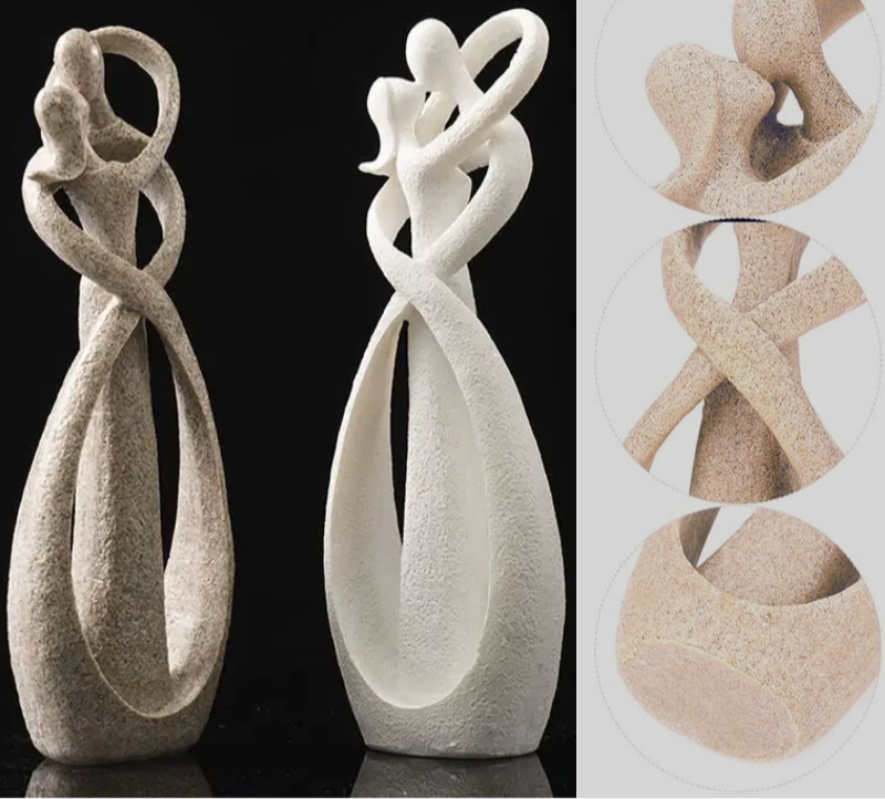 Abstract beeldje van twee figuren in een omhelzing
